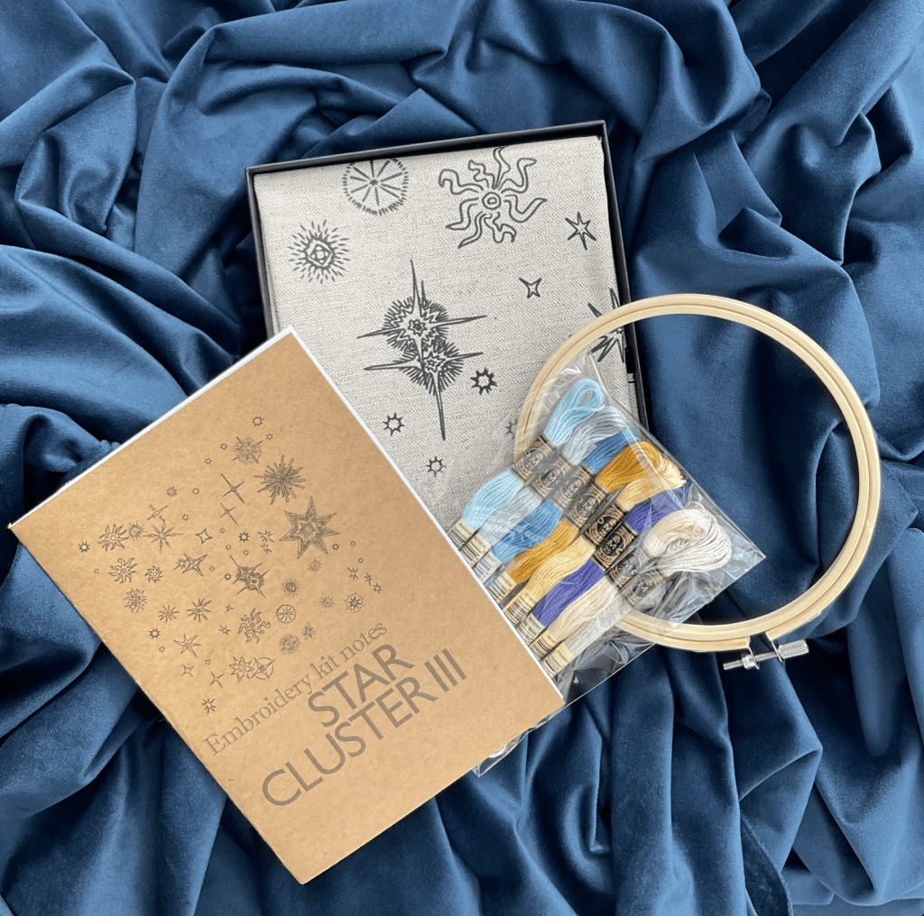The Star Cluster III embroidery kit comes with a pre printed out line design, hoop, needles and threads